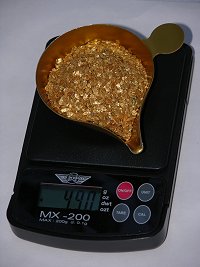 What are some ways that fire is used to refine gold?