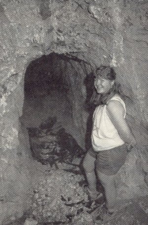 : Lu Anne Warren, author's wife, standing in front of the entrance to the Monte Cristo Mine 